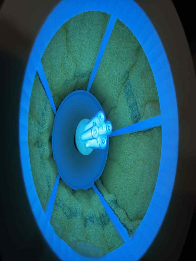 view of the 254nm UV light bulb shining on the catalyst pads to generate mold mycotoxin neutralizing hydroxyls