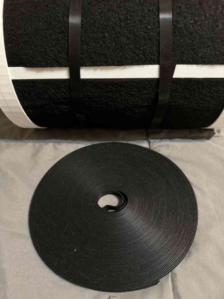 assembled filter with tightened velcro strips securing it and roll of velcro in foreground